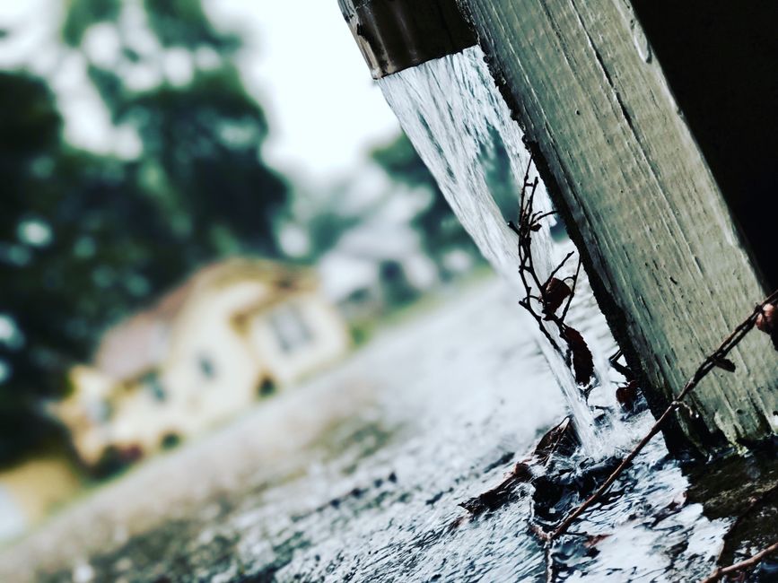 overflowing gutter and downspout
